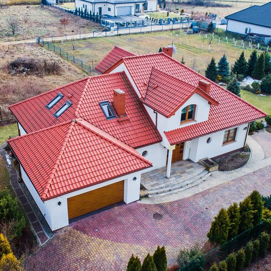 An Aerial View of a Red Tile Roof.